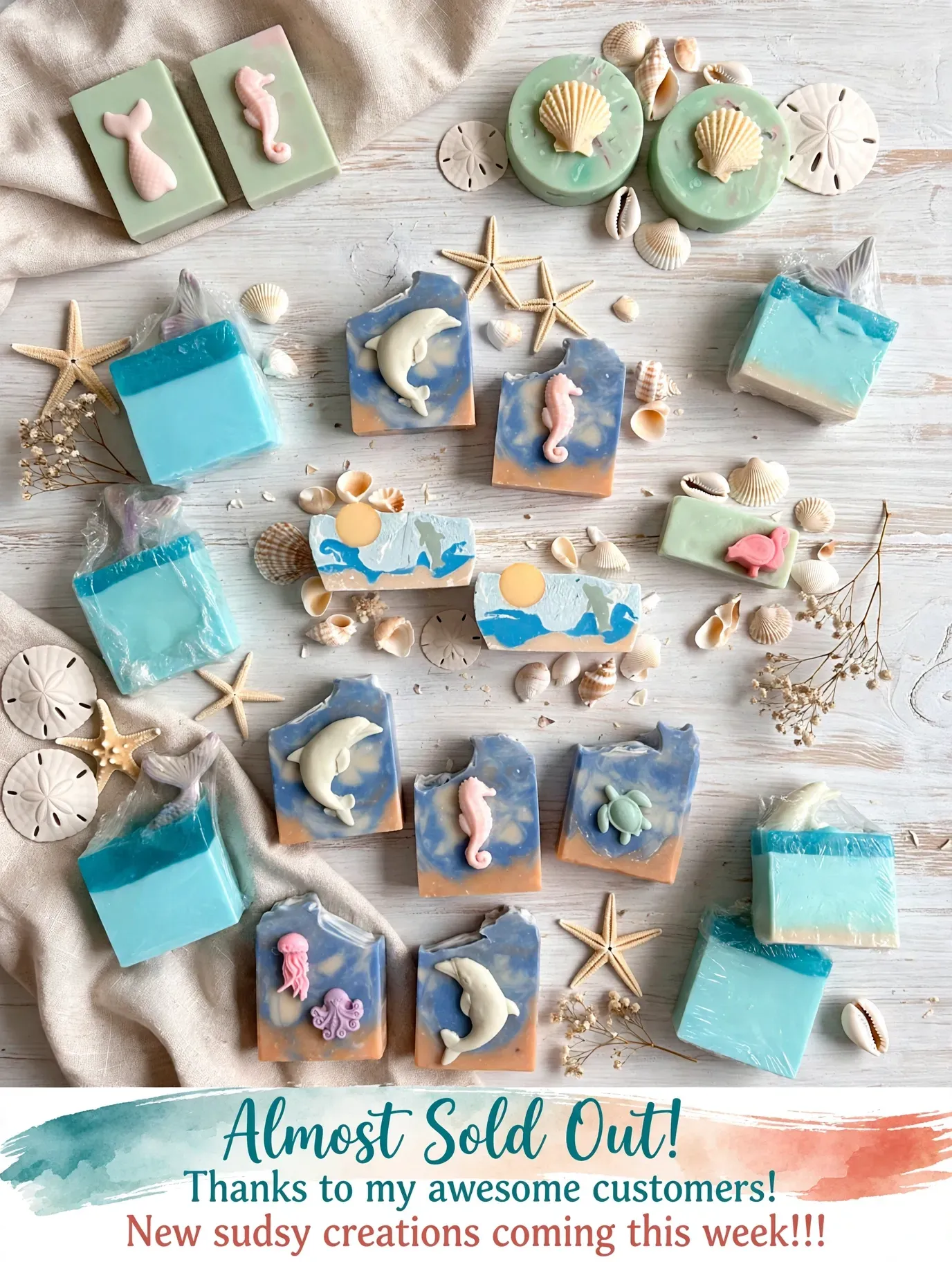 Coastal collection of handmade soaps arranged on white wood